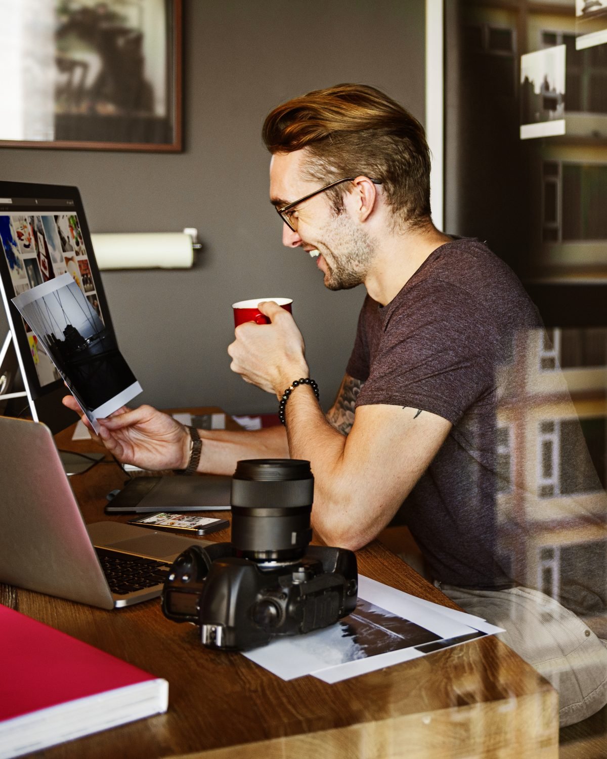 A marketer reviewing printed campaign results at a desk