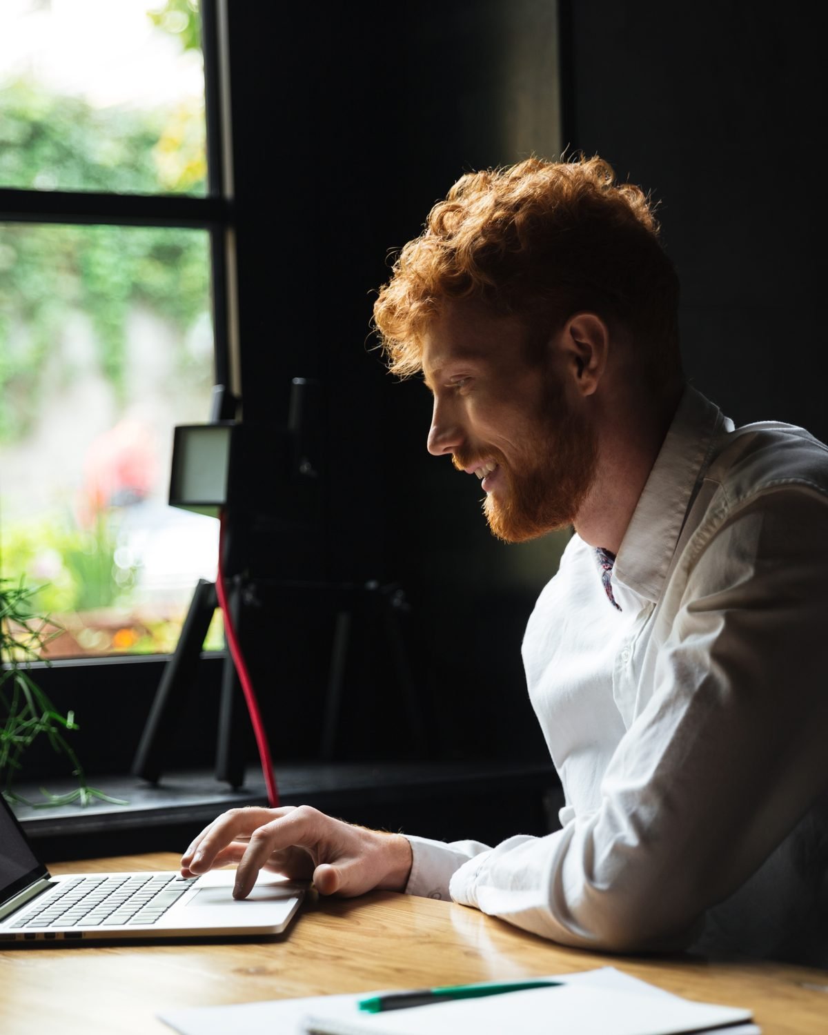 A marketer working through a checklist at a desk