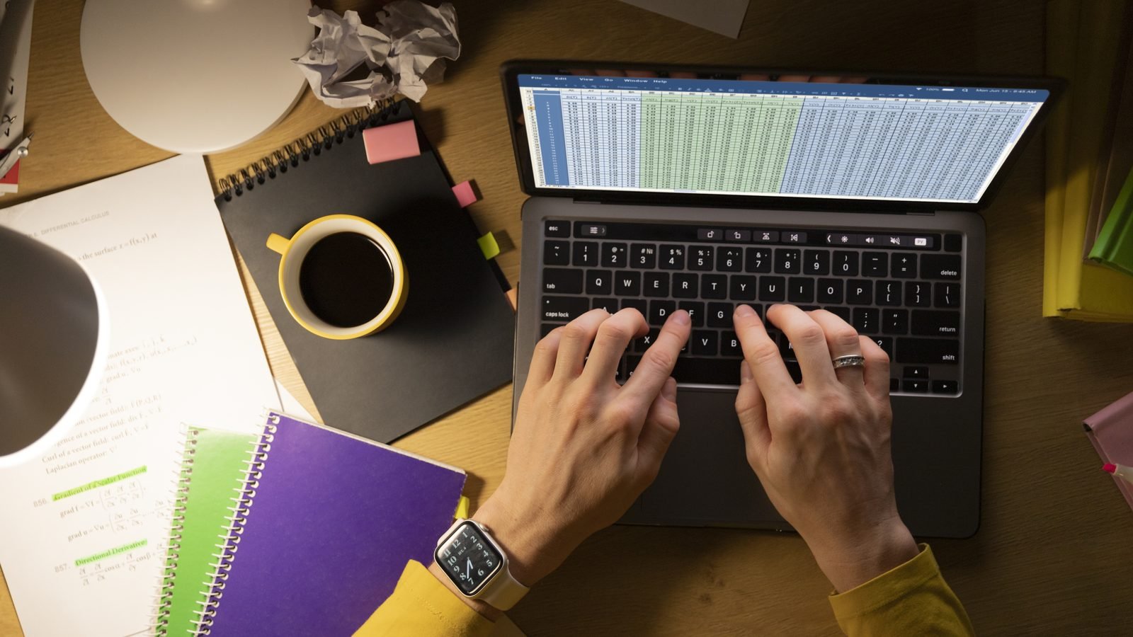 A marketer reviewing an email on screen with notes